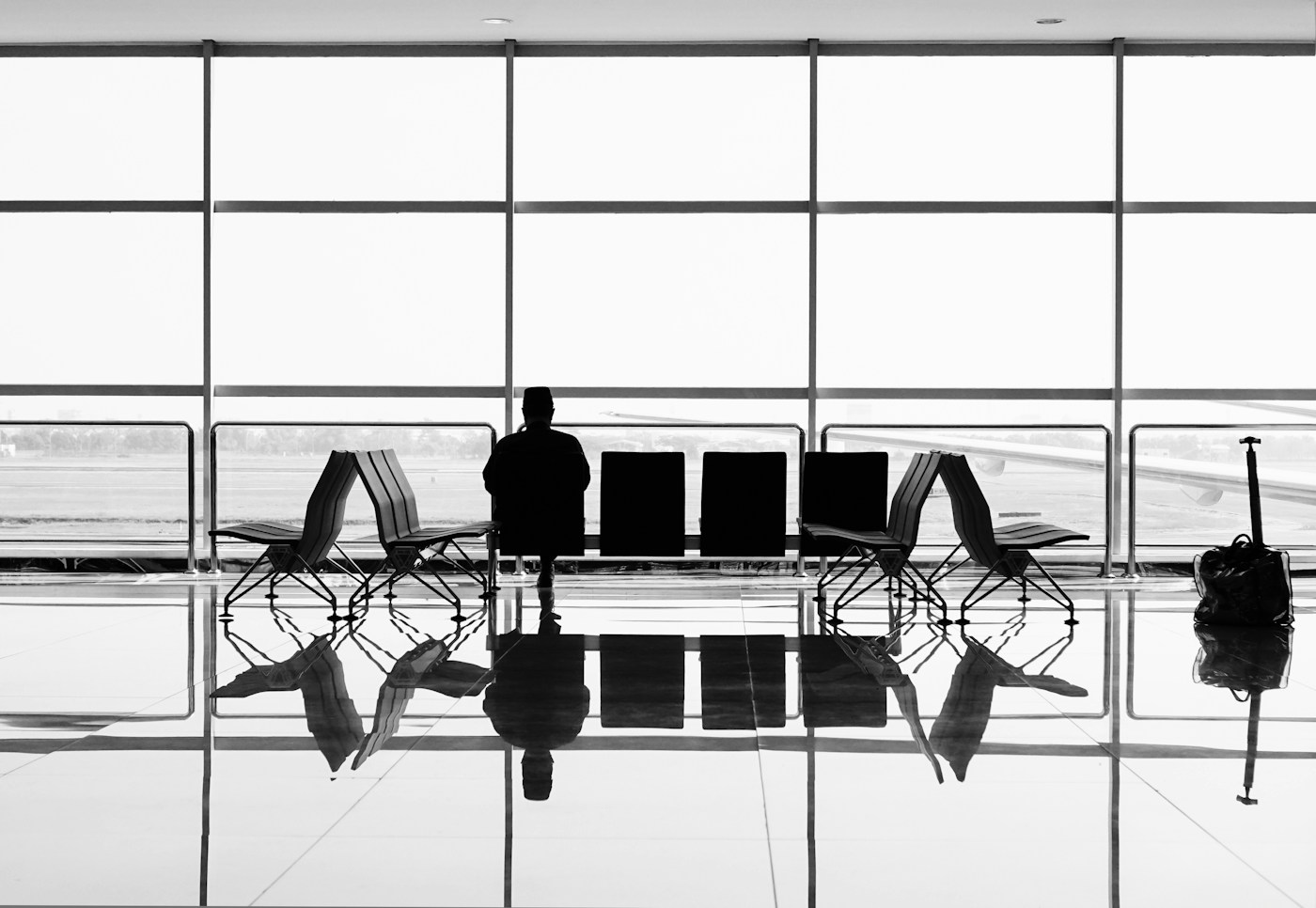 Traveller waiting with luggage at an airport